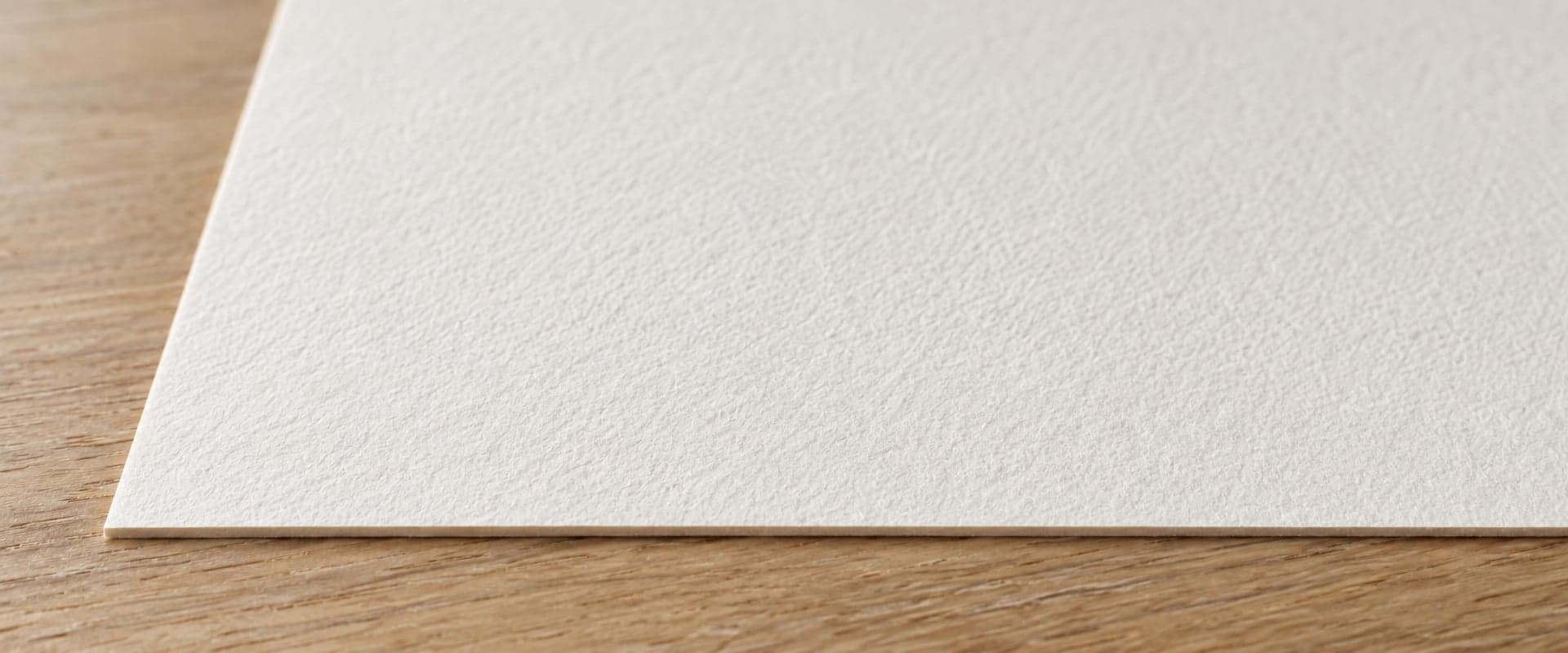 The edge of a sheet of textured etching paper, close up