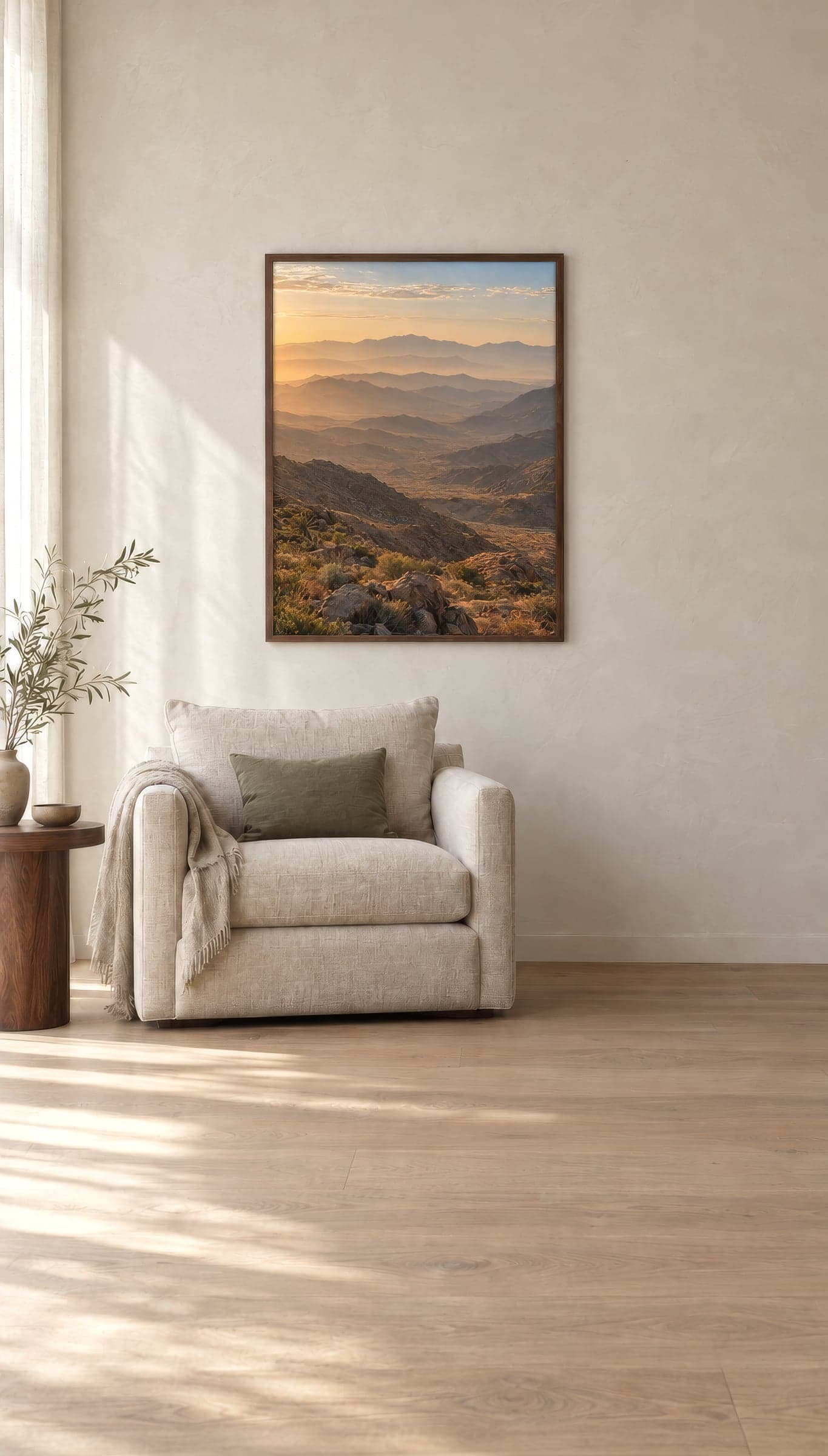 Framed prints of desert landscapes at dawn in a sunlit living room