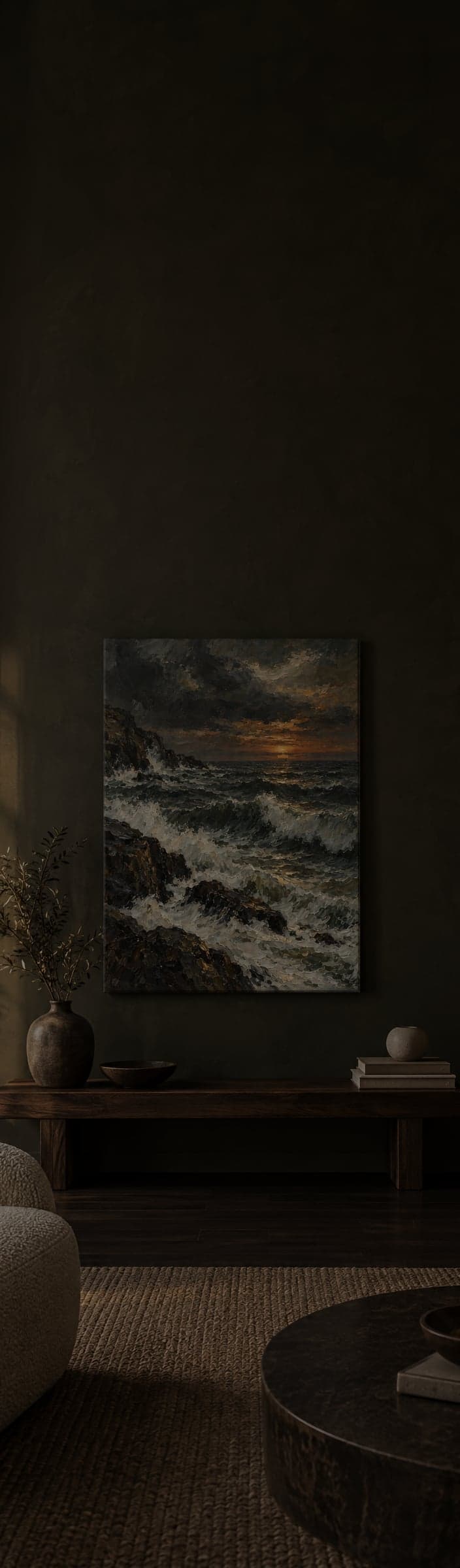 A canvas of stormy waves at sunset on a dark wall above a low bench